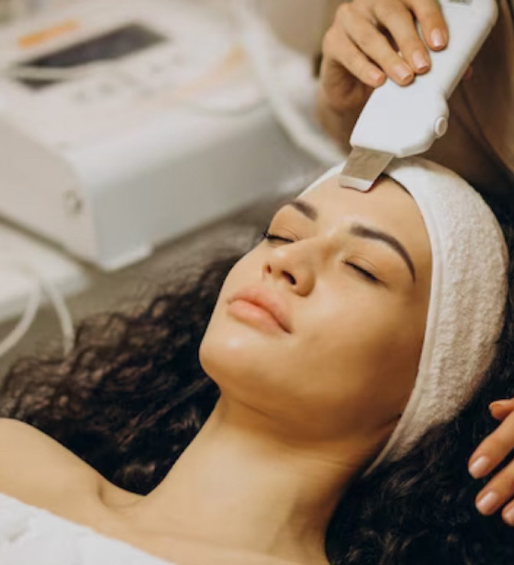 A person hands removing hair from forfront of a young lady